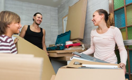 House movers loading furniture in a Wandsworth residential street