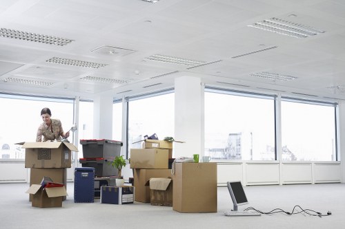 Office relocation scene with desks and boxes in Wandsworth